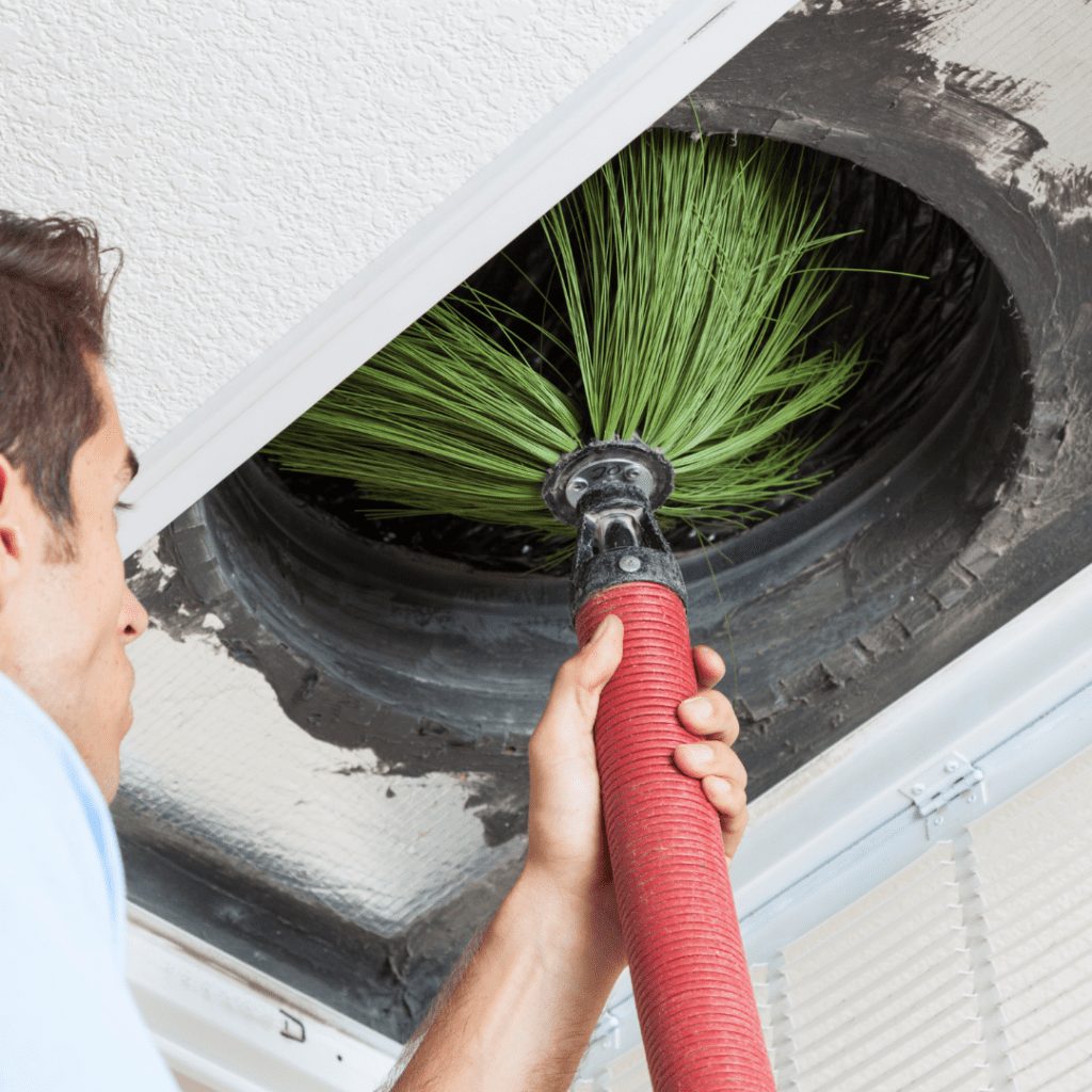 air conditioning duct cleaning tool going into vent