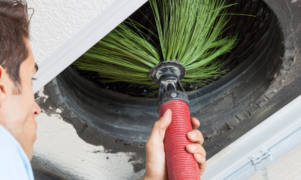air conditioning duct cleaning tool going into vent